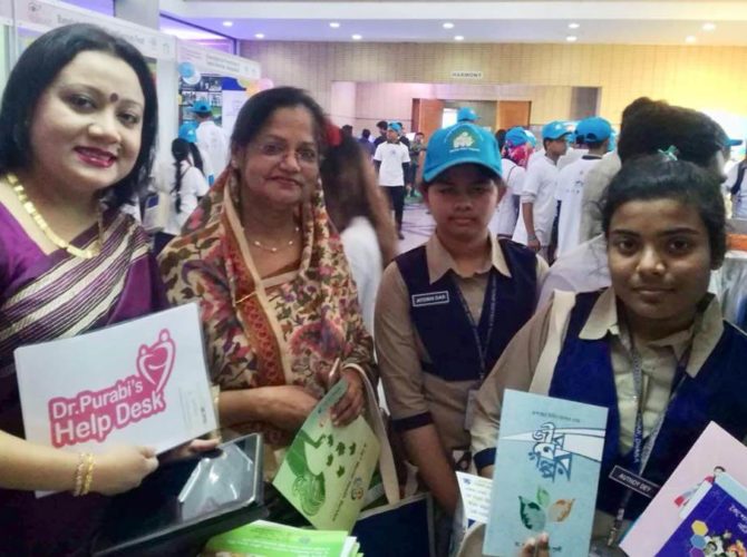 Displaying her health education tools among the adolescent