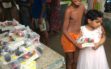 Distributing lunch to the underprivileged children