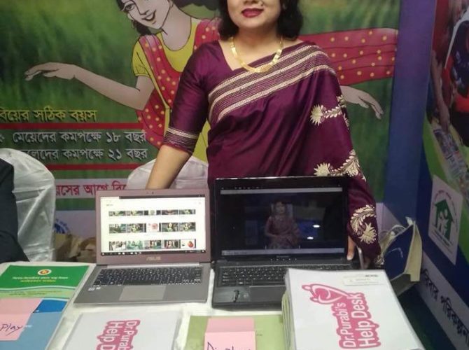 displaying her health education tools at a fair organized by Unicef
